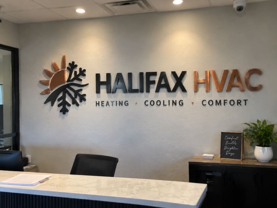 Dimensional acrylic lobby logo in a commercial reception
