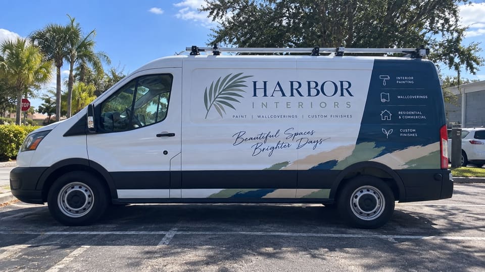 Commercial van with high-coverage vehicle wrap graphics
